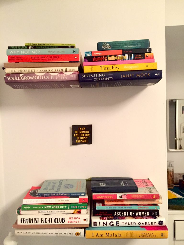 Invisible bookshelves hold up 4 stacks of books